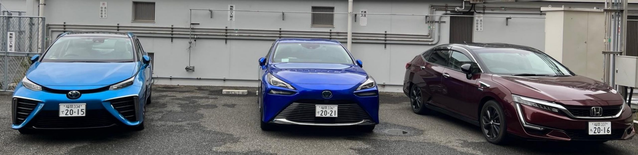 hydrogen fuel cell based cars, light blue toyota honda, blue toyota and burgundy honda  parked